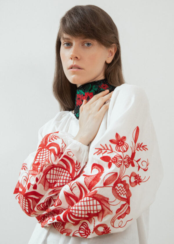 Blouse based on the motifs of a traditional shirt with designer embroidery