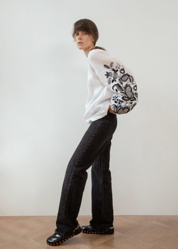 Blouse based on the motifs of a traditional shirt with designer embroidery (black ornament)