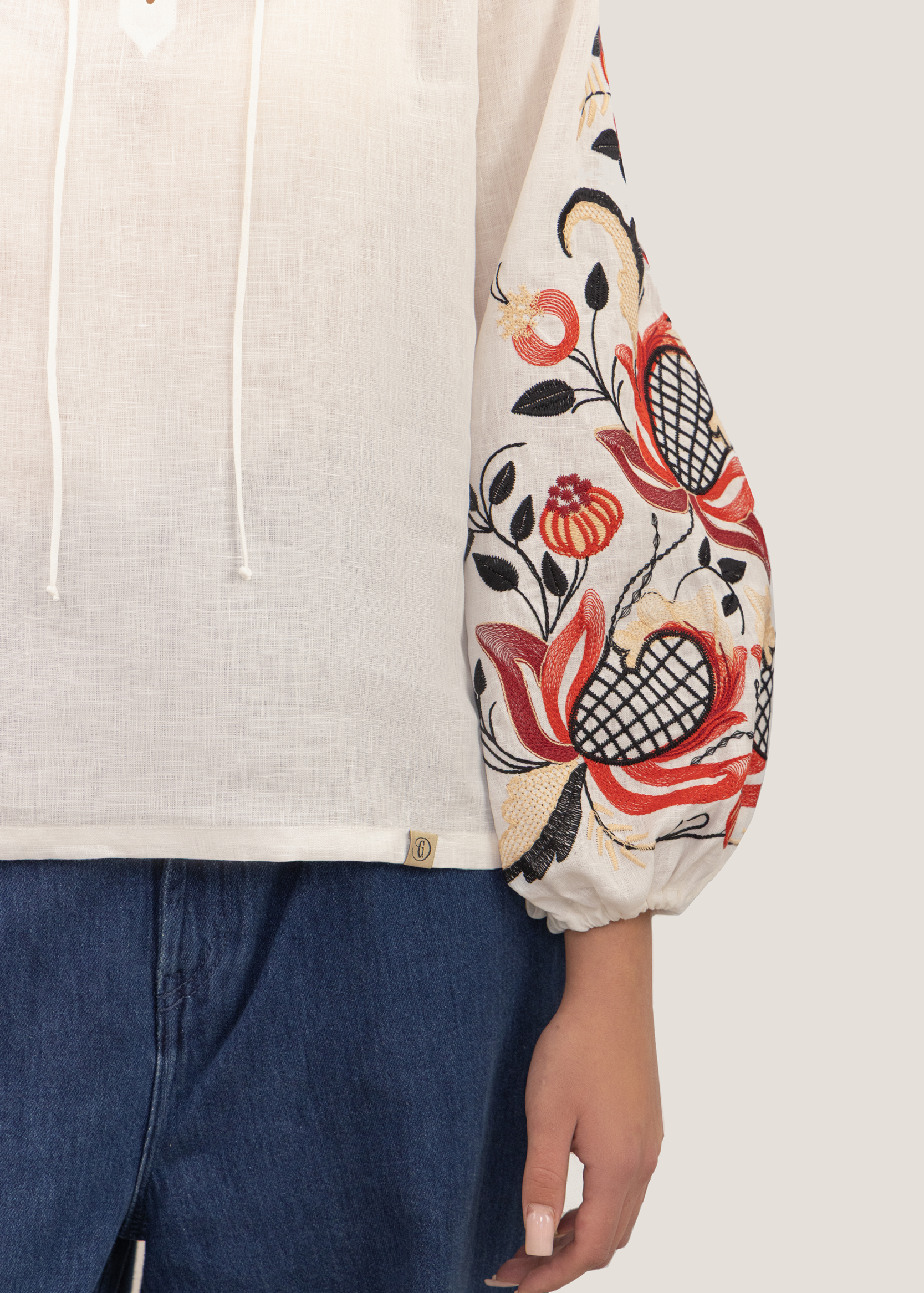 Blouse inspired by a traditional shirt with designer embroidery (colorful ornament)