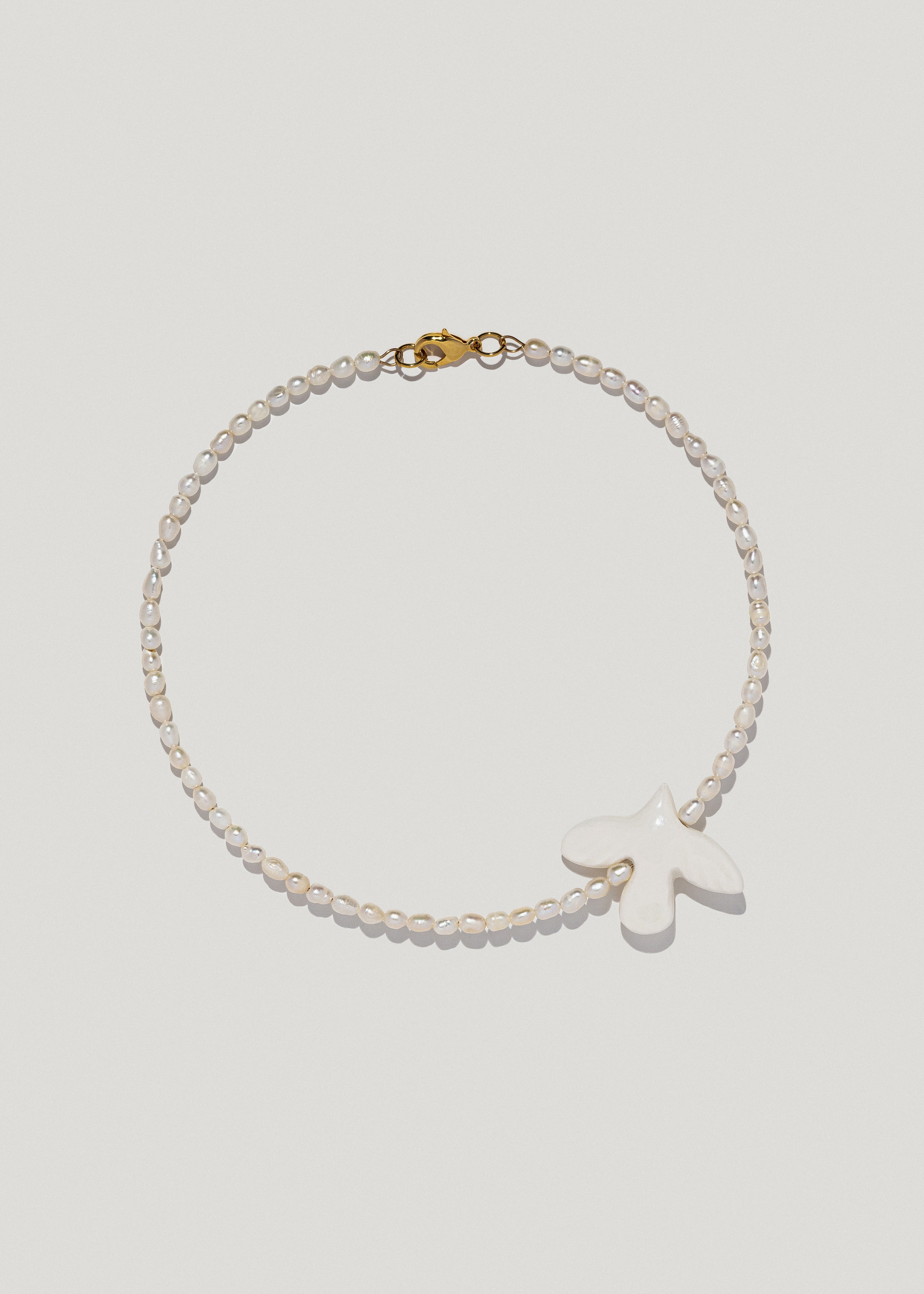 Necklace "Myrni" with oval pearls and a dove