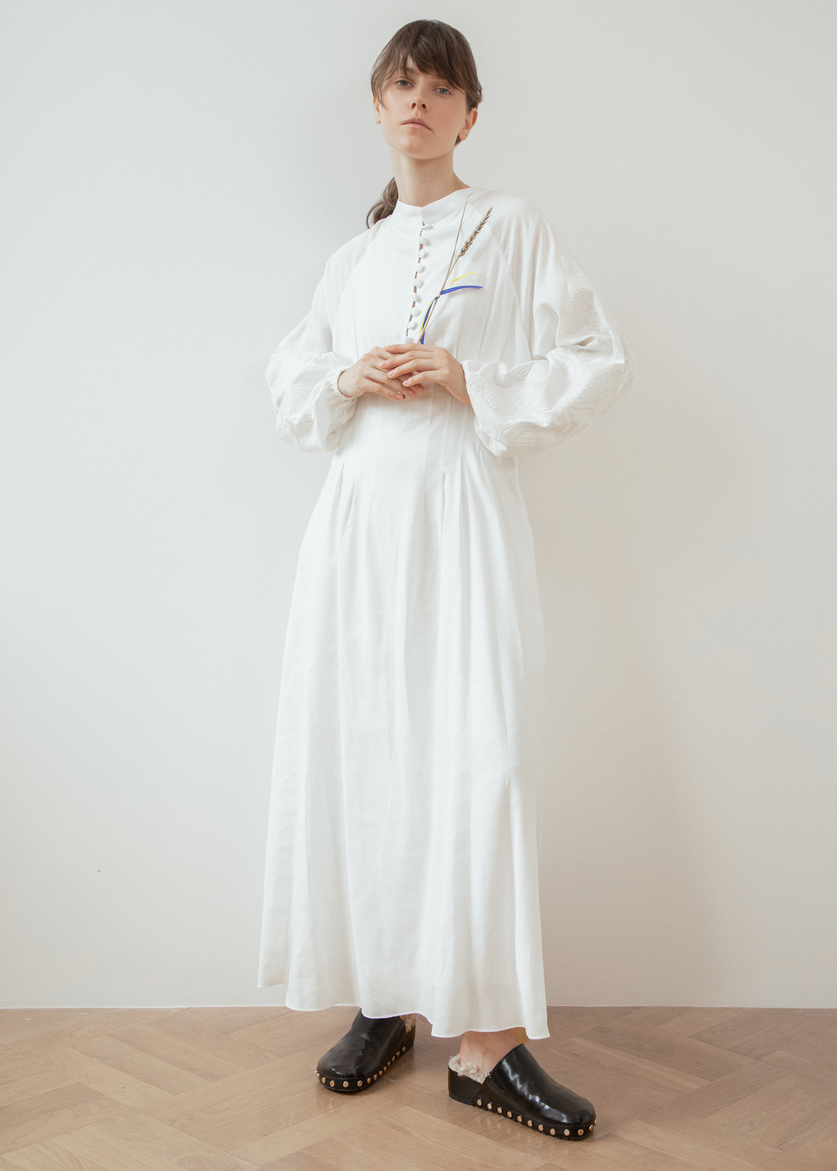 Dress based on the motifs of a traditional shirt with designer embroidery white