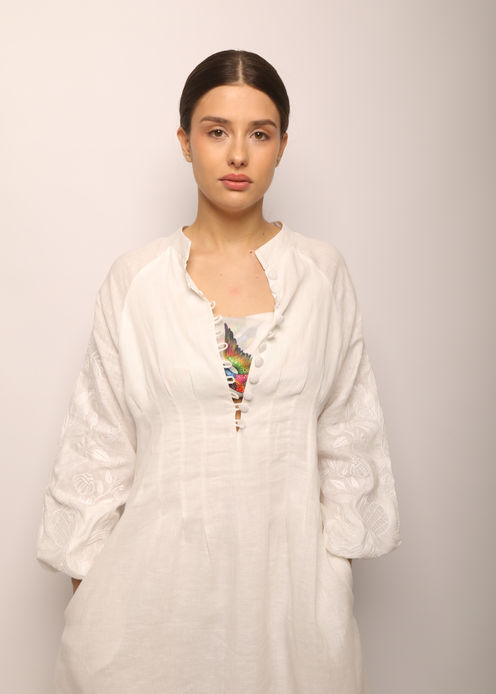 Dress based on the motifs of a traditional shirt with designer embroidery white