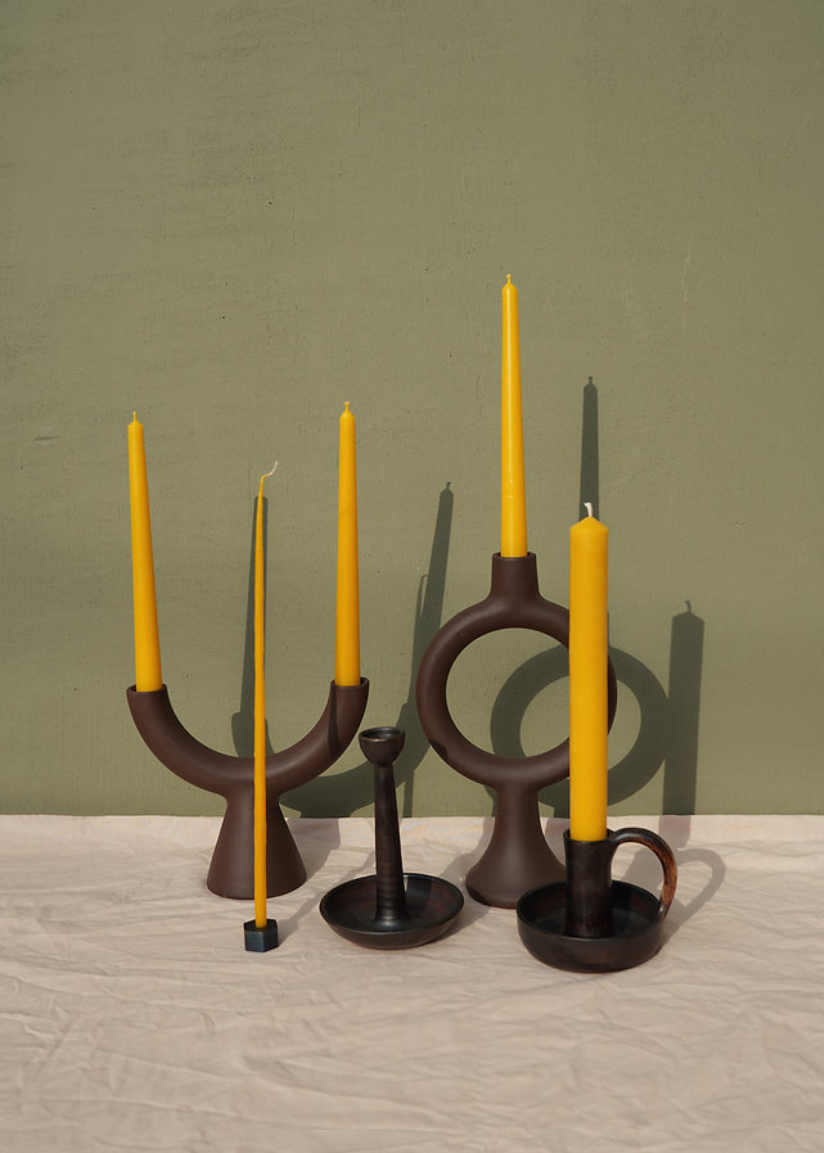 Tall candle holder for a single candle