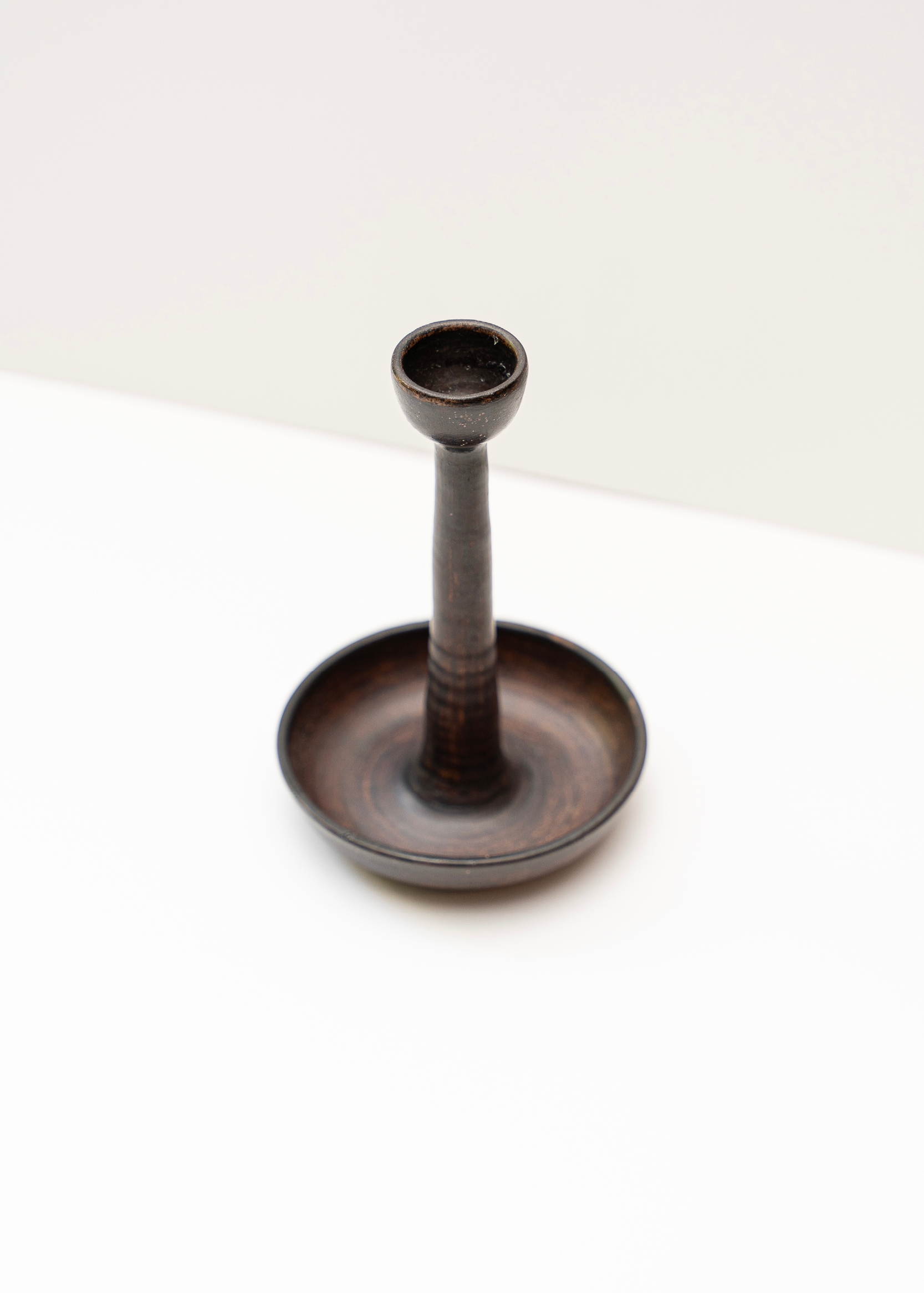 Tall candle holder for a single candle