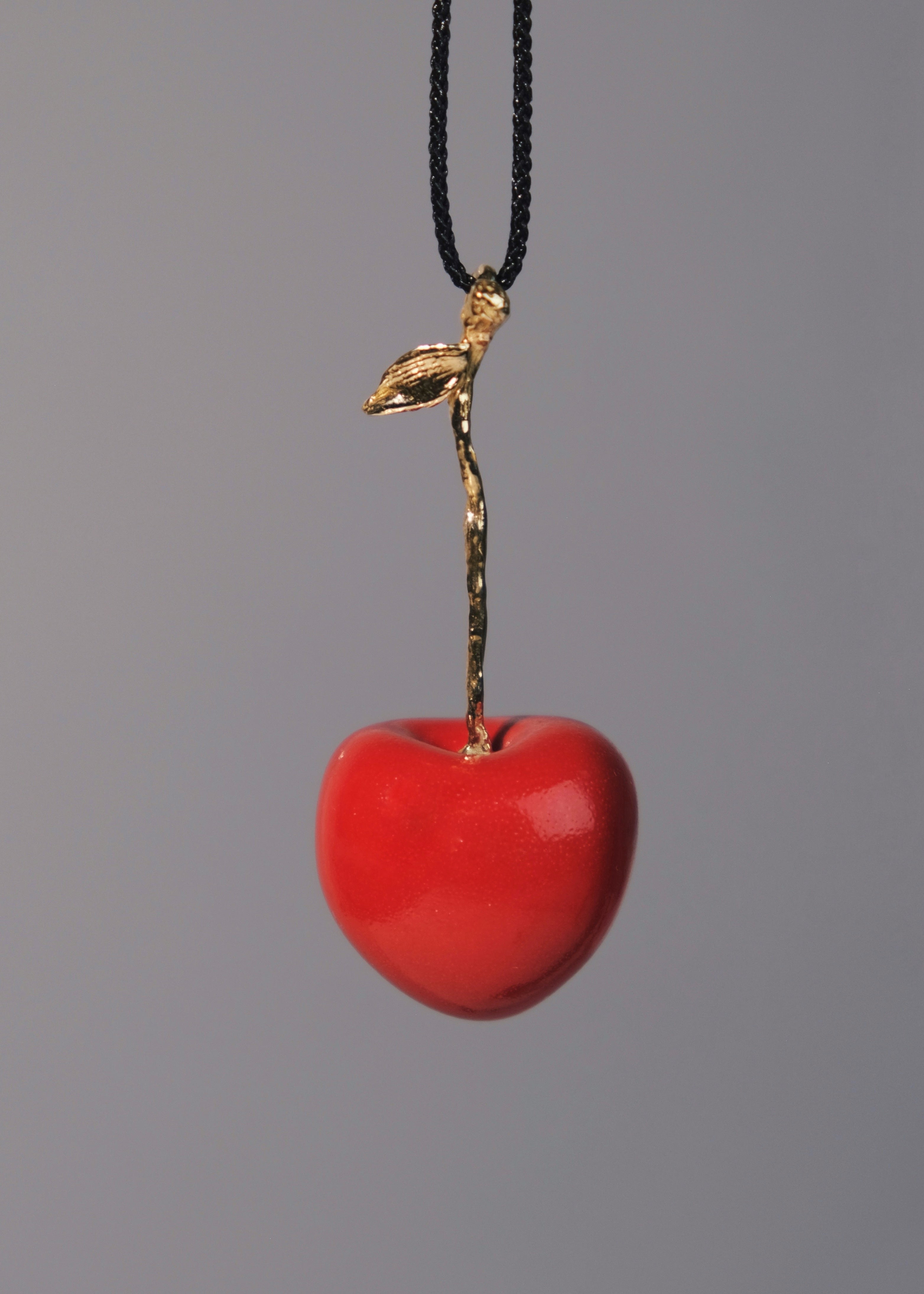 "Cherry" pendant on a cord (brass)