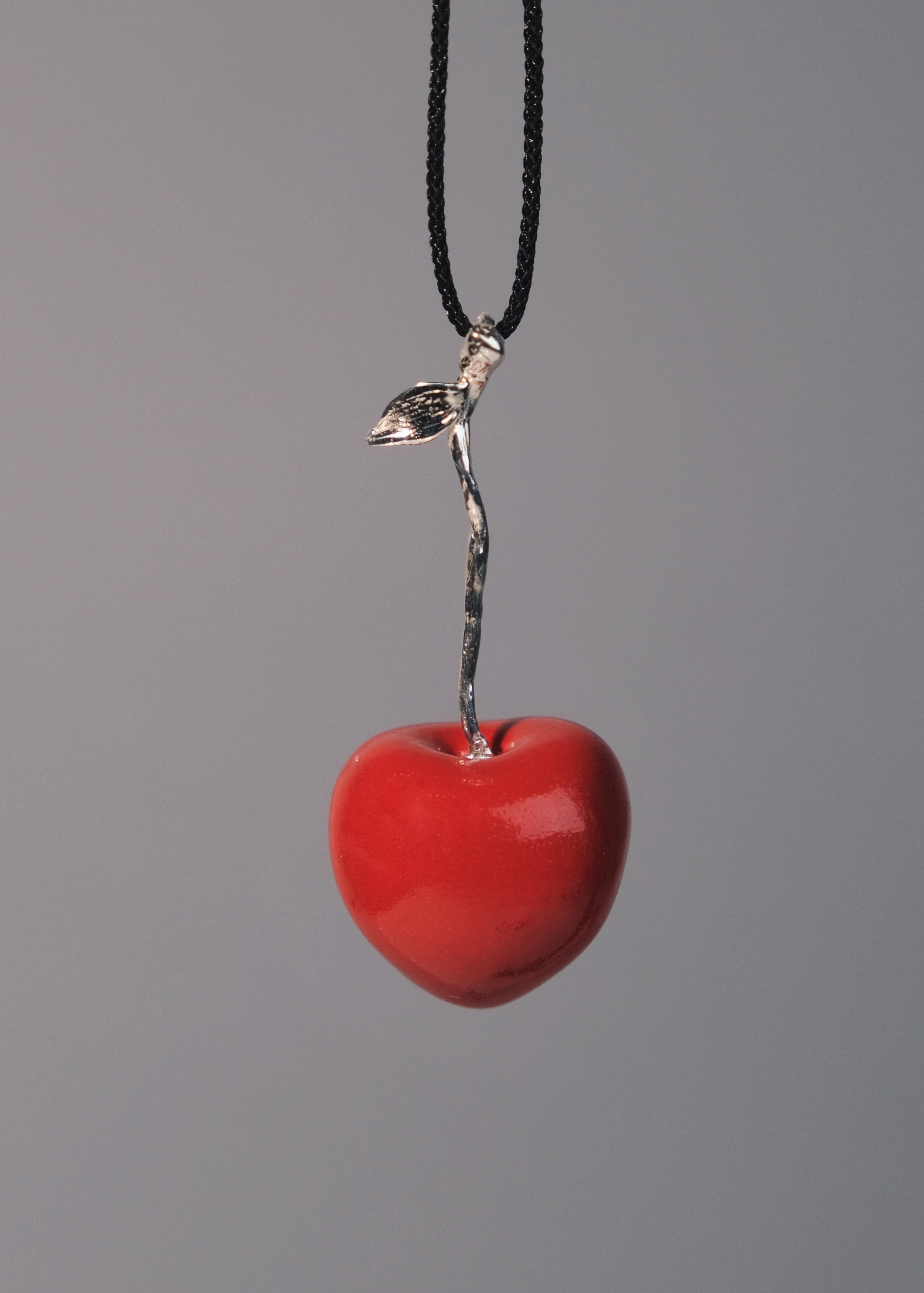 "Cherry" pendant on a cord (silver)