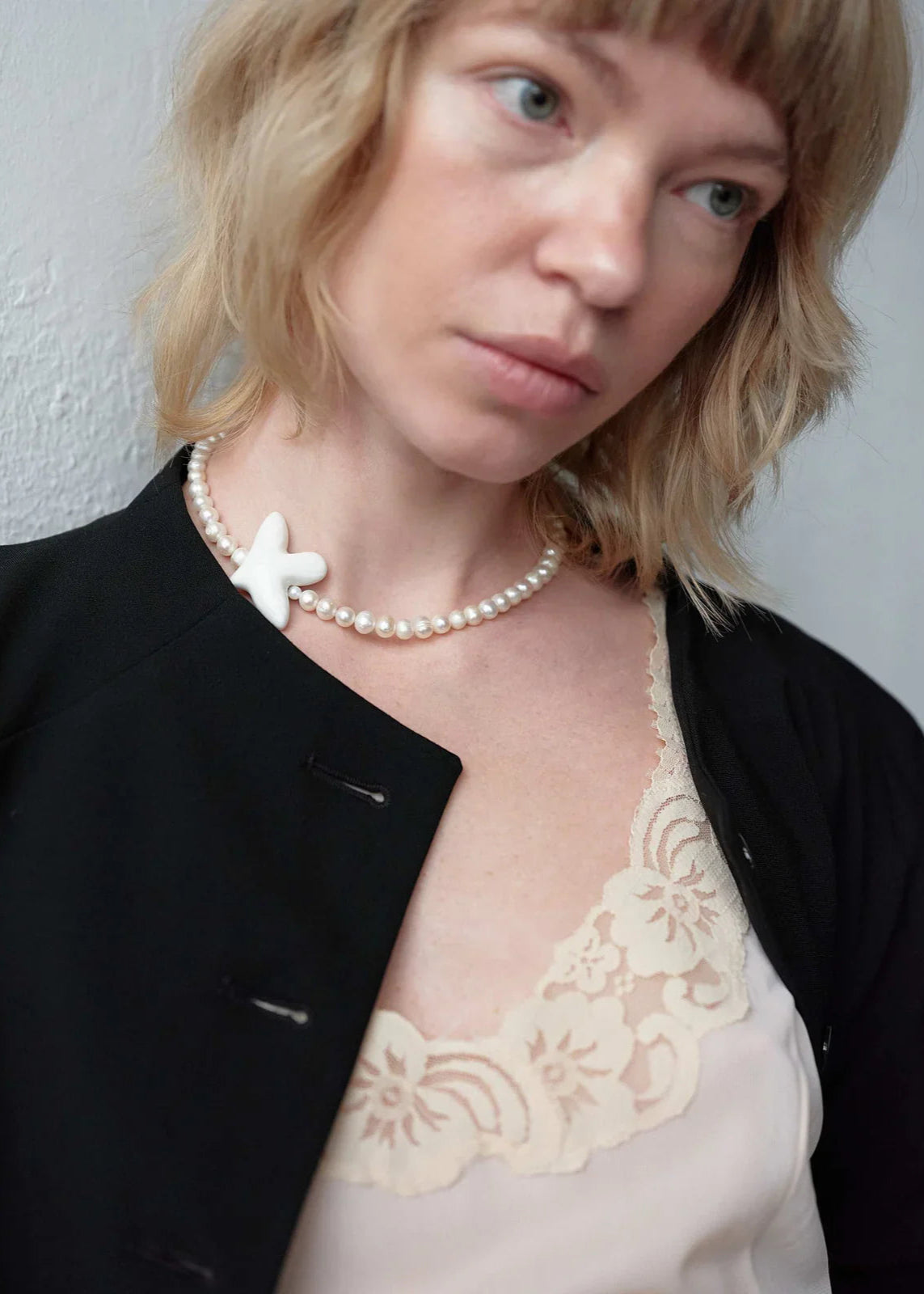 Necklace "Myrni" pearls and a dove on a soft base