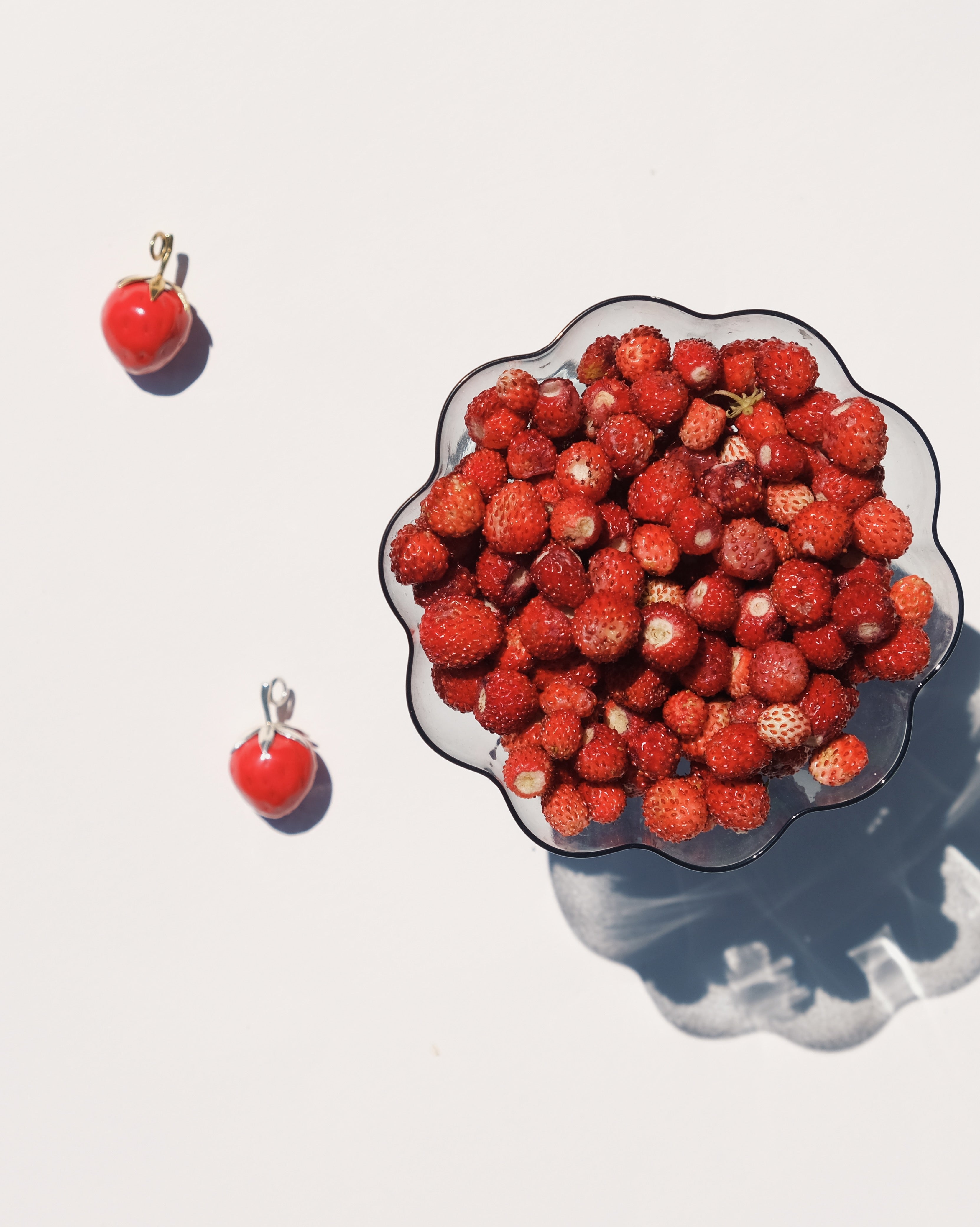 "Strawberry" pendant on a cord (brass)