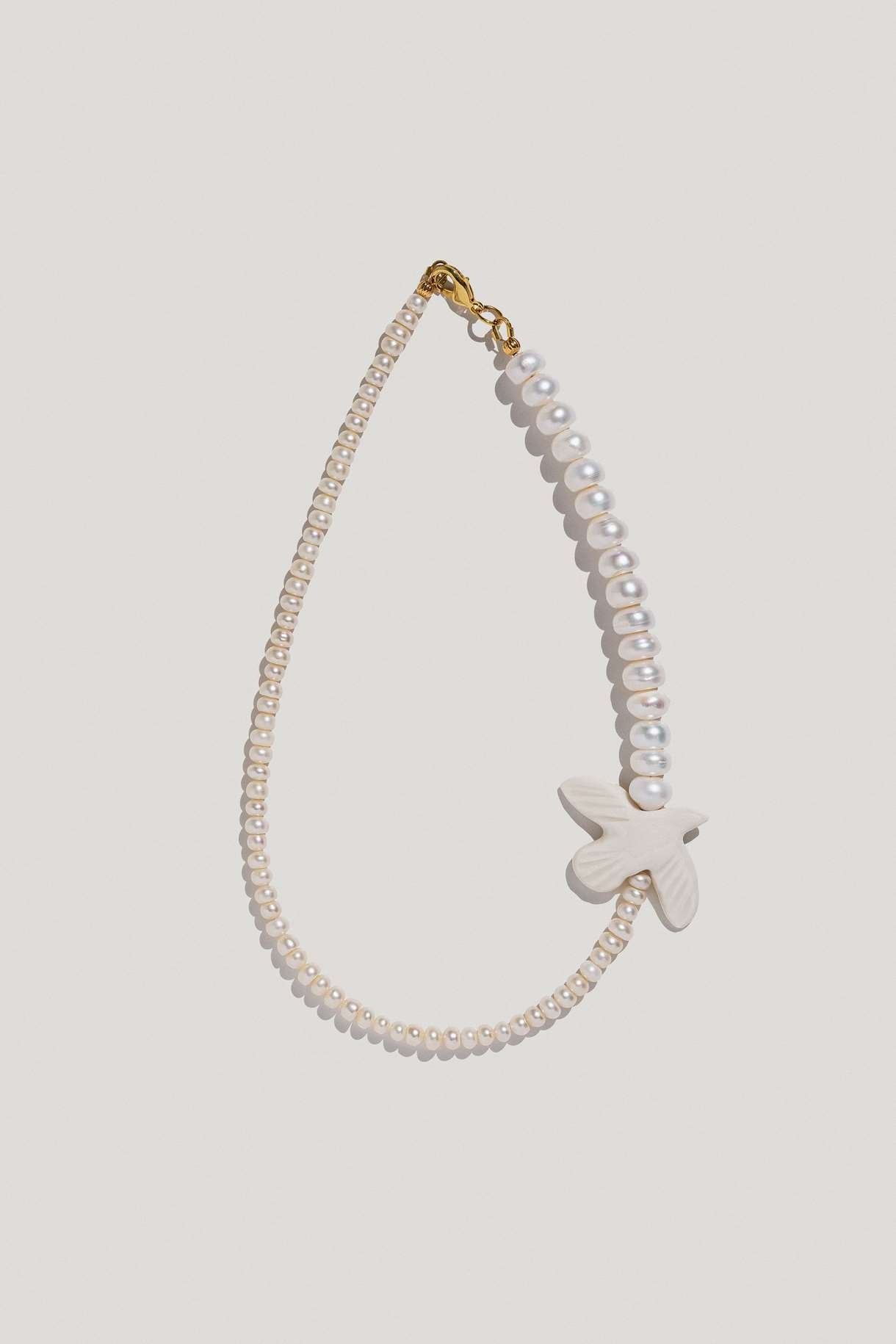 Necklace "Myrni" with two kinds of pearls and a dove