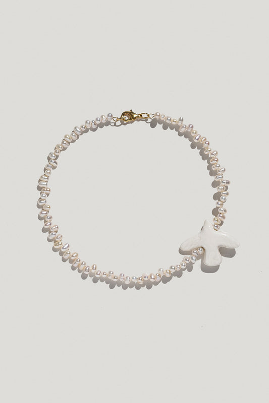 Necklace "Myrni" with uneven pearls and a dove