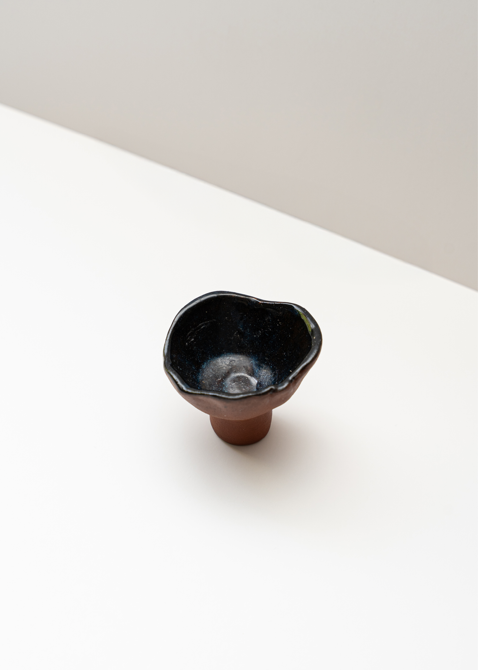 Asymmetric ceramic candle holder