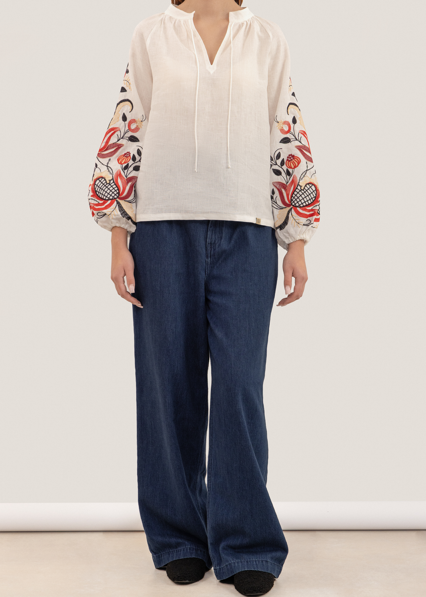 Blouse inspired by a traditional shirt with designer embroidery (colorful ornament)