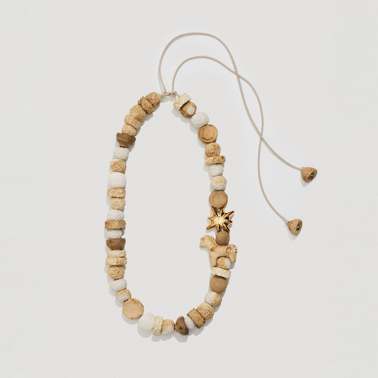 Necklace "Drimota" milky beads with a gold star