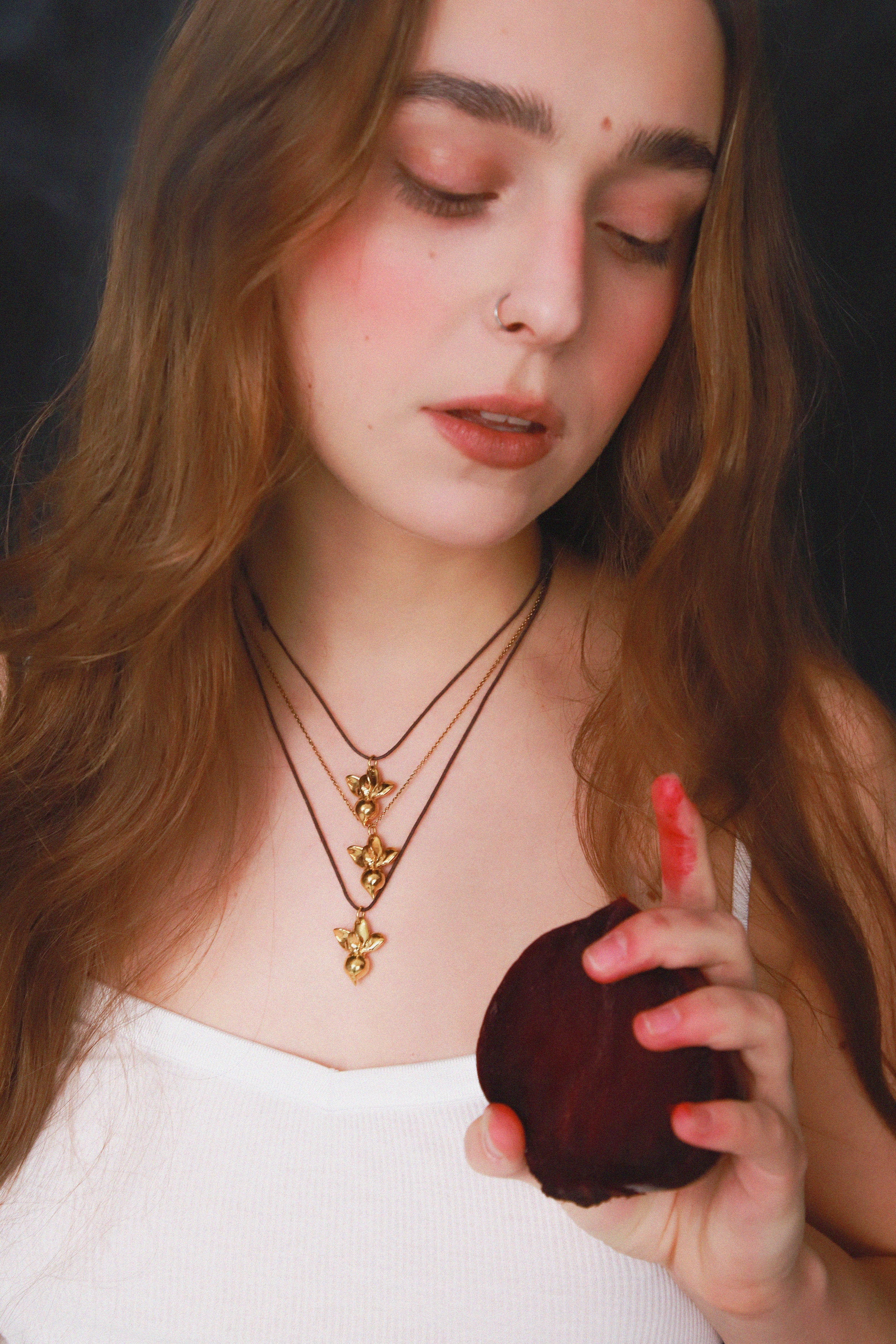 "Beetroot" pendant on a cord (brass, gold plating)