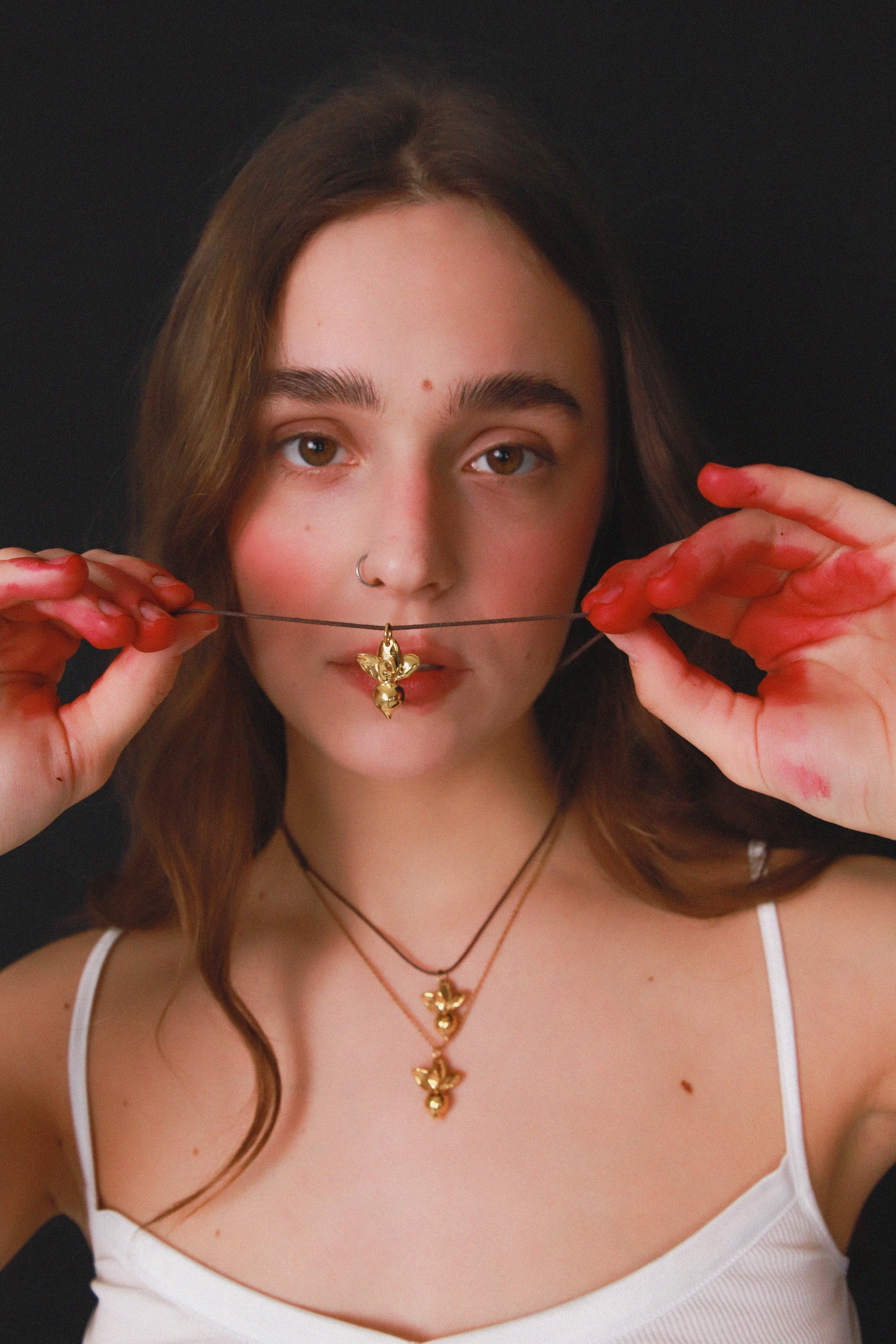 "Beetroot" pendant on a cord (brass, gold plating)