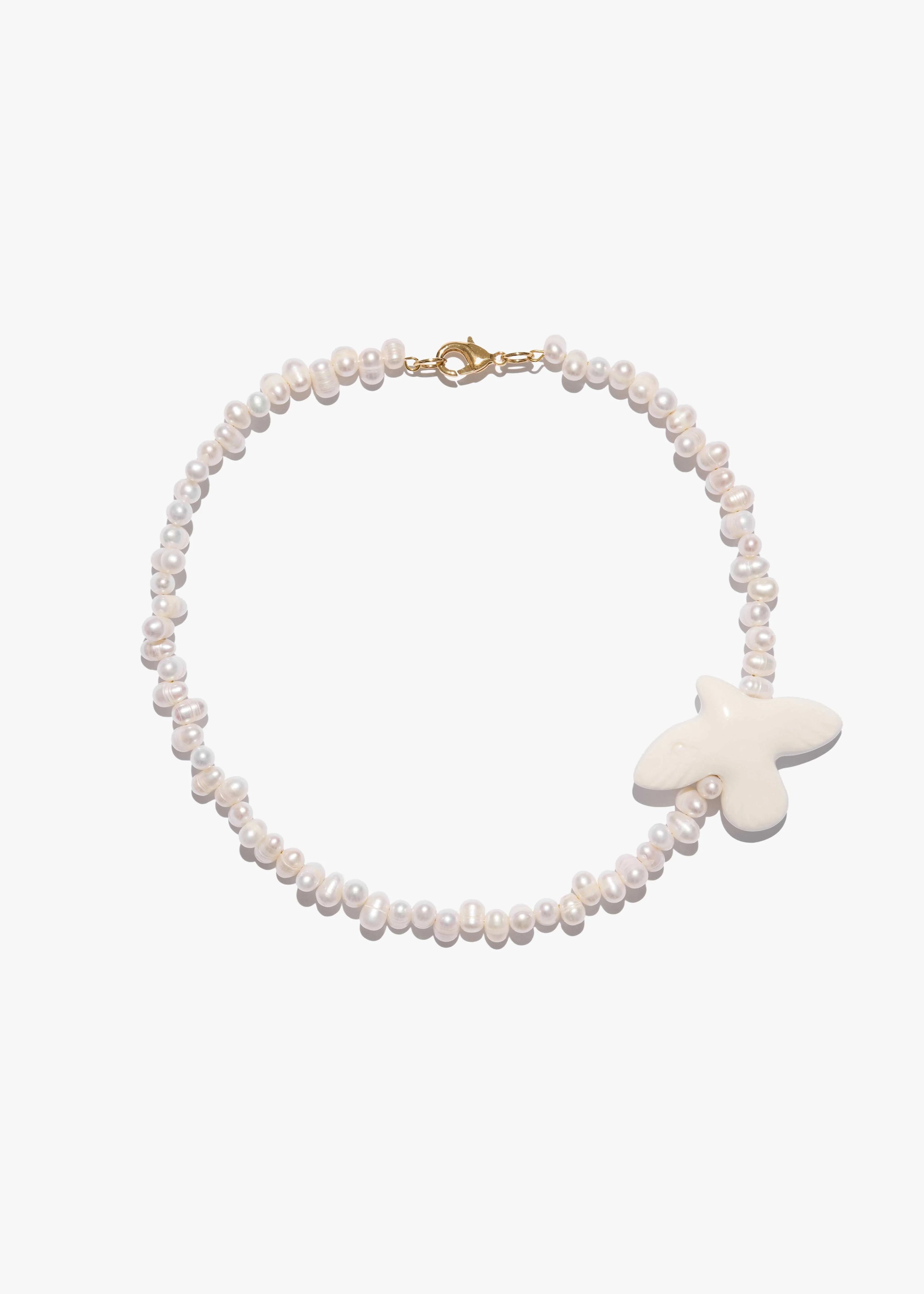 Necklace "Myrni" with uneven pearls and a dove