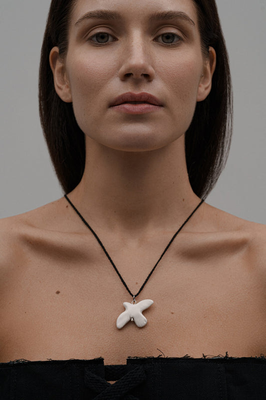 Dove pendant on a cord "MYRNI"